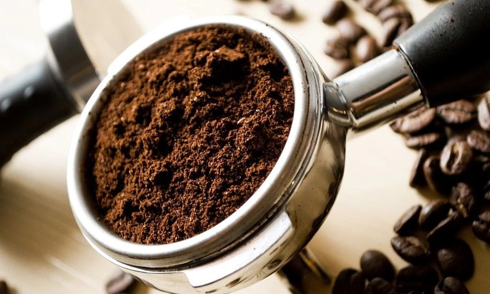 A close up of coffee grounds in a cup